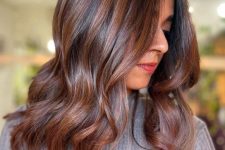 long dark hair with chestnut balayage and waves is a stylish and catchy idea for a bold and chic look