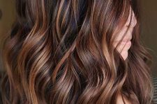 a cute hairstyle with copper balayage