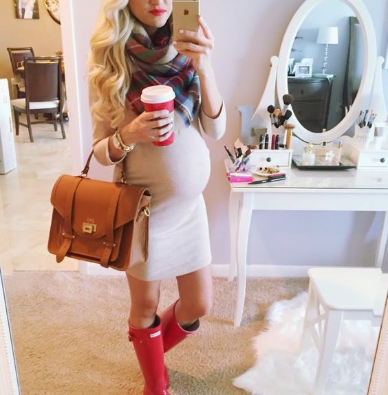 a neutral dress, a blanket scarf and red rain boots