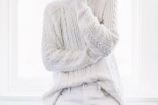05 a white cable knit sweater and ripped denim