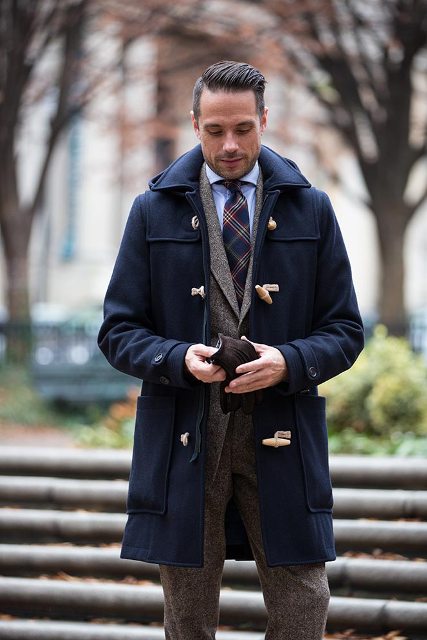 a navy duffle coat, a grey tweed suit and a striped tie