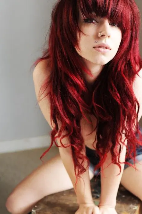 chic long wavy red hair with a bang