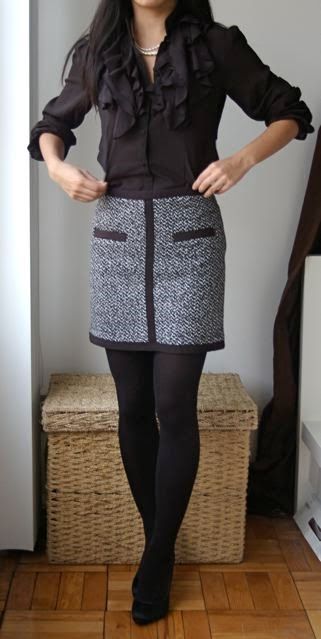 a tweed mini skirt and a black ruffled blouse for a monochrome look