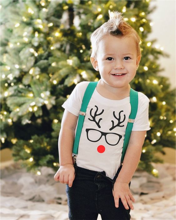 jeans, suspenders and a white tee with a reindeer