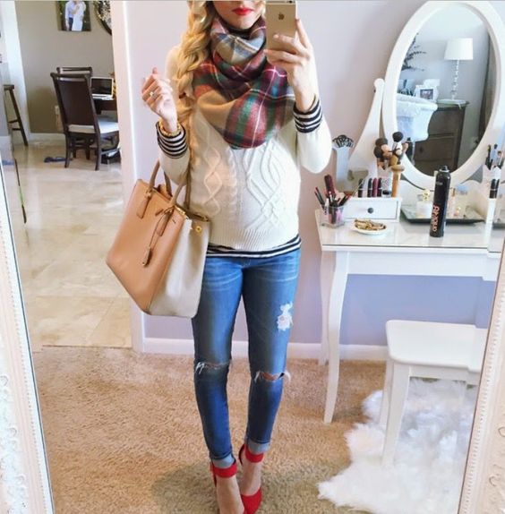 ripped jeans, a white sweater, a plaid scarf and red shoes
