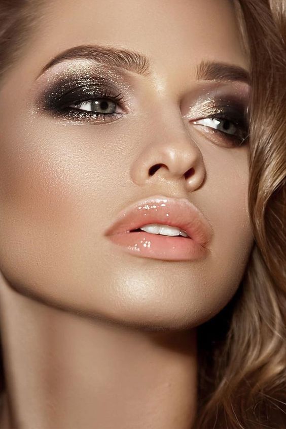 shimmering smokey eyes and a glossy nude lip for a bold holiday makeup
