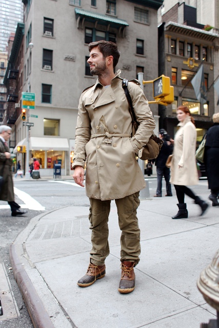 With beige coat and sporty pants