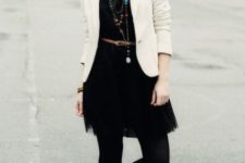 With black dress, tights, white jacket and hat