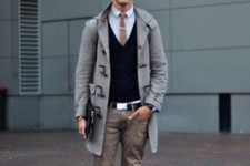 With button down shirt, black vest, gray trousers and mid calf boots