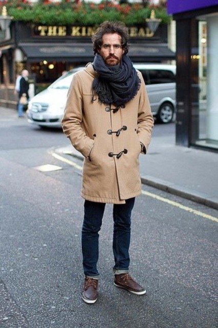 With cuffed jeans, brown shoes and oversized scarf