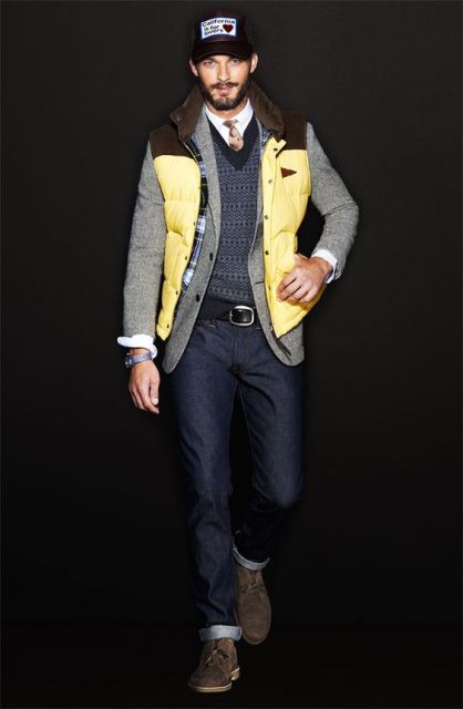 With cuffed jeans, white shirt, tie, printed sweater, jacket and cap