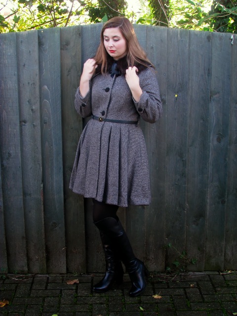 With dress, black tights and high boots