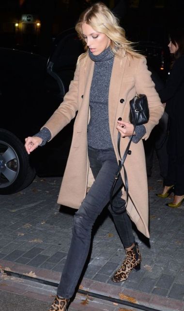 With gray turtleneck, pants, camel coat and mini bag