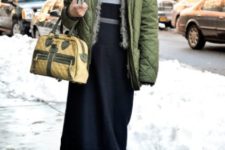 With midi skirt, puffer jacket, beanie and small bag