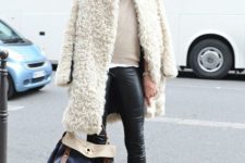 With neutral sweater, skinny pants, mid calf flat boots and leather bag