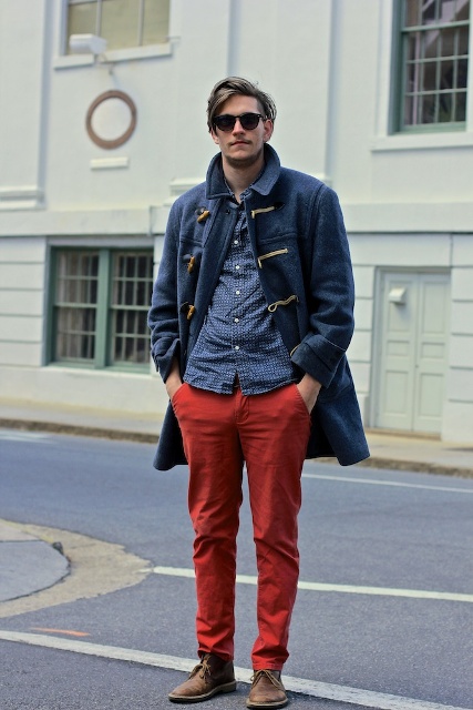 With patterned shirt, red pants and brown shoes