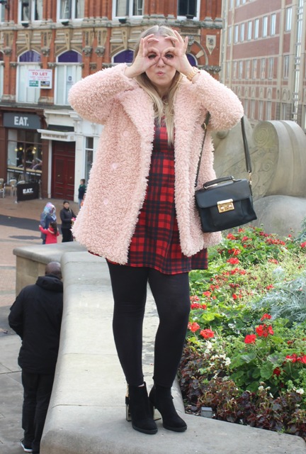 With plaid dress, black tights and ankle boots