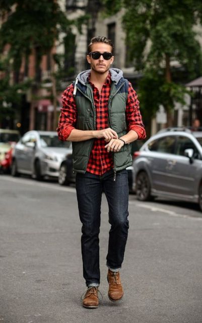 With plaid shirt, cuffed jeans and brown boots