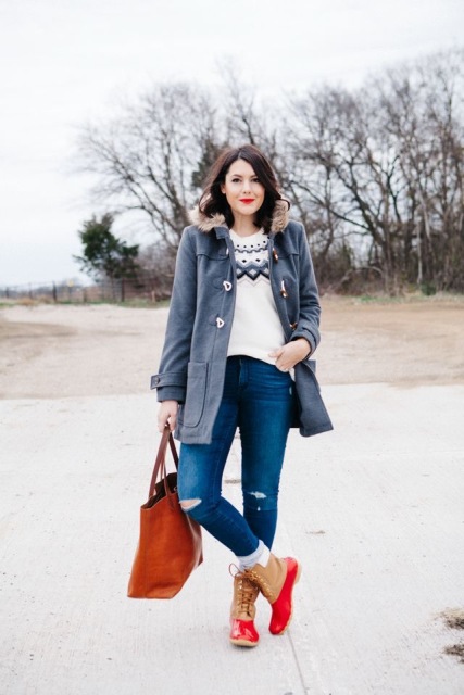 With printed sweater, distressed jeans and red tote
