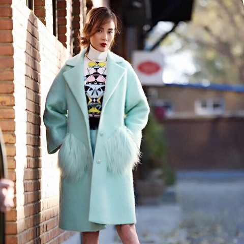 With printed turtleneck and mint skirt