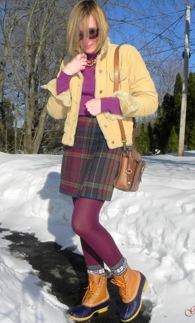 With purple turtleneck, plaid mini skirt, yellow jacket and purple tights