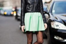 With skater skirt, leather jacket and printed tights