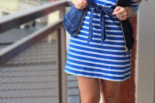 With striped dress and puffer vest