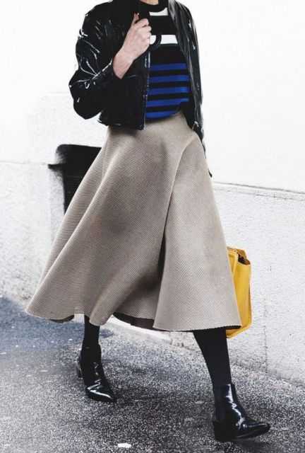With striped shirt, leather jacket, A-line midi skirt and yellow bag