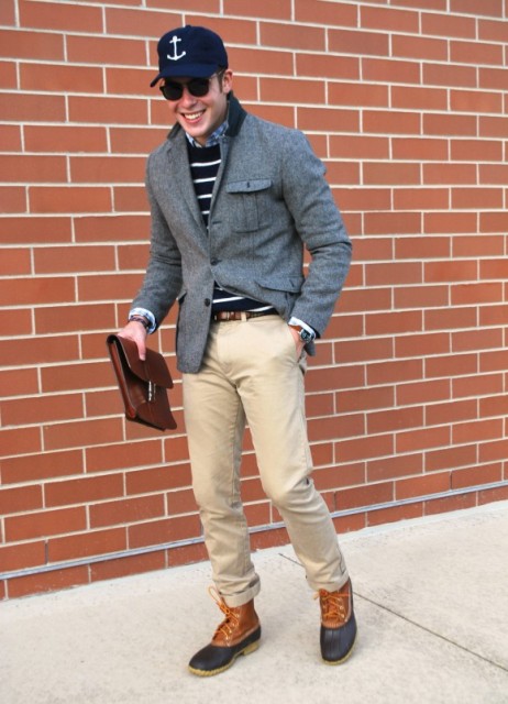 With striped sweater, camel pants, leather belt, tweed jacket and cap