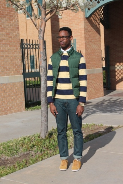 With striped sweater, jeans and sneakers