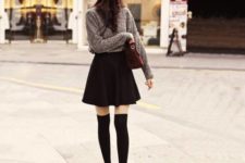 With sweater, mini skirt and beanie