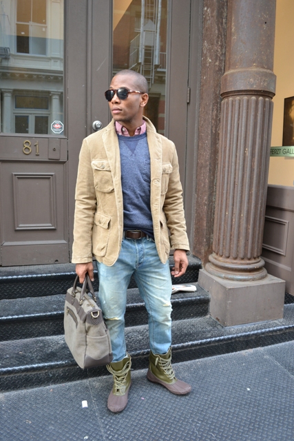 With sweatshirt, distressed jeans and camel jacket