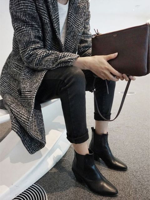 With tweed coat, white shirt, cuffed pants and clutch