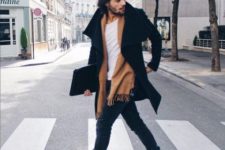 With white shirt, black coat, brown scarf and jeans