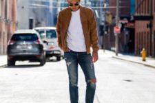 With white shirt, brown jacket and distressed jeans