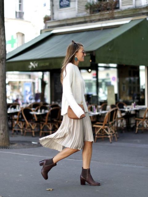 With white sweater, pleated skirt and crossbody bag