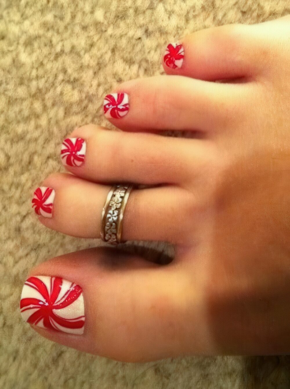 Candy cane red toe nails for Christmas.