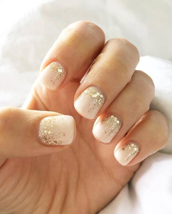 neutral manicure accented with just a touch of gold sparkly glitter