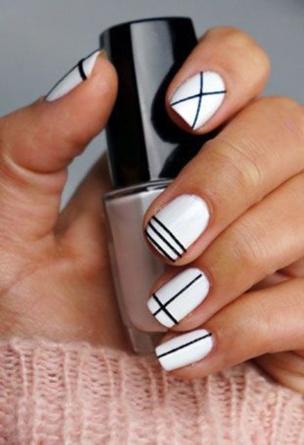 white nails with black geometric design