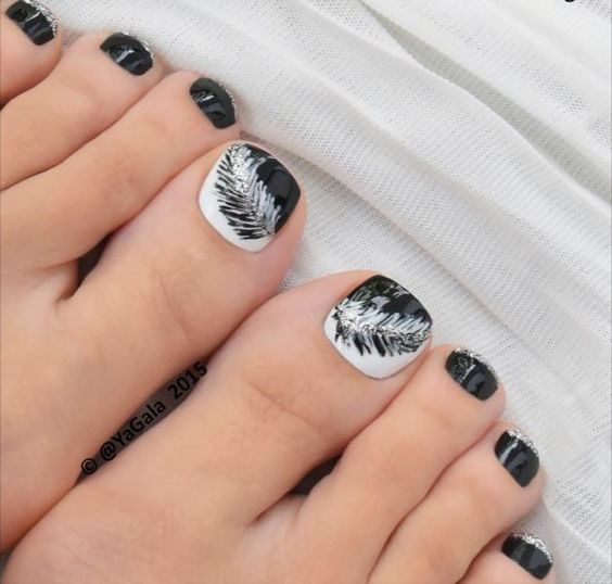 black and white feather toe nail art