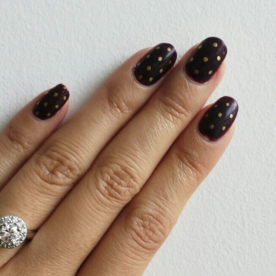 burgundy nails with gold polka dots