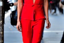 16 fitted red jumpsuit with a lot of details