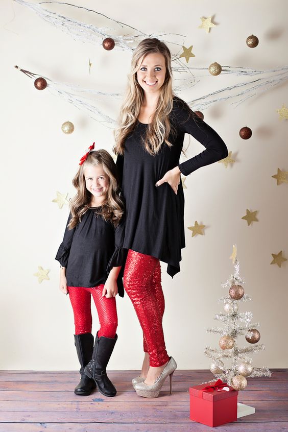black tunics, red sequin pants and shoes for the mom, black boots for the daughter