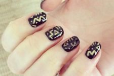 19 tribal nail art with gold decor on black