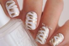 21 white and gold nail art made with a gold sharpie