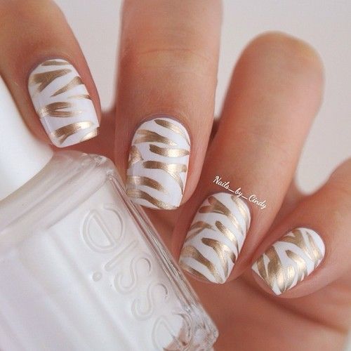 white and gold nail art made with a gold sharpie