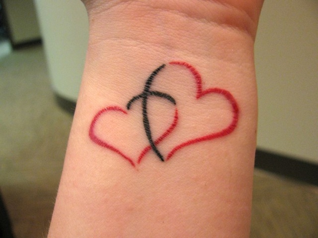 Black and red double hearts tattoo