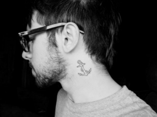 Black-contour anchor tattoo