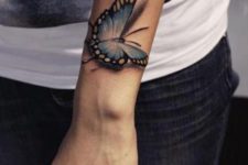 Blue and yellow 3D butterfly tattoo