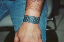 Blue wrist bracelet tattoo
